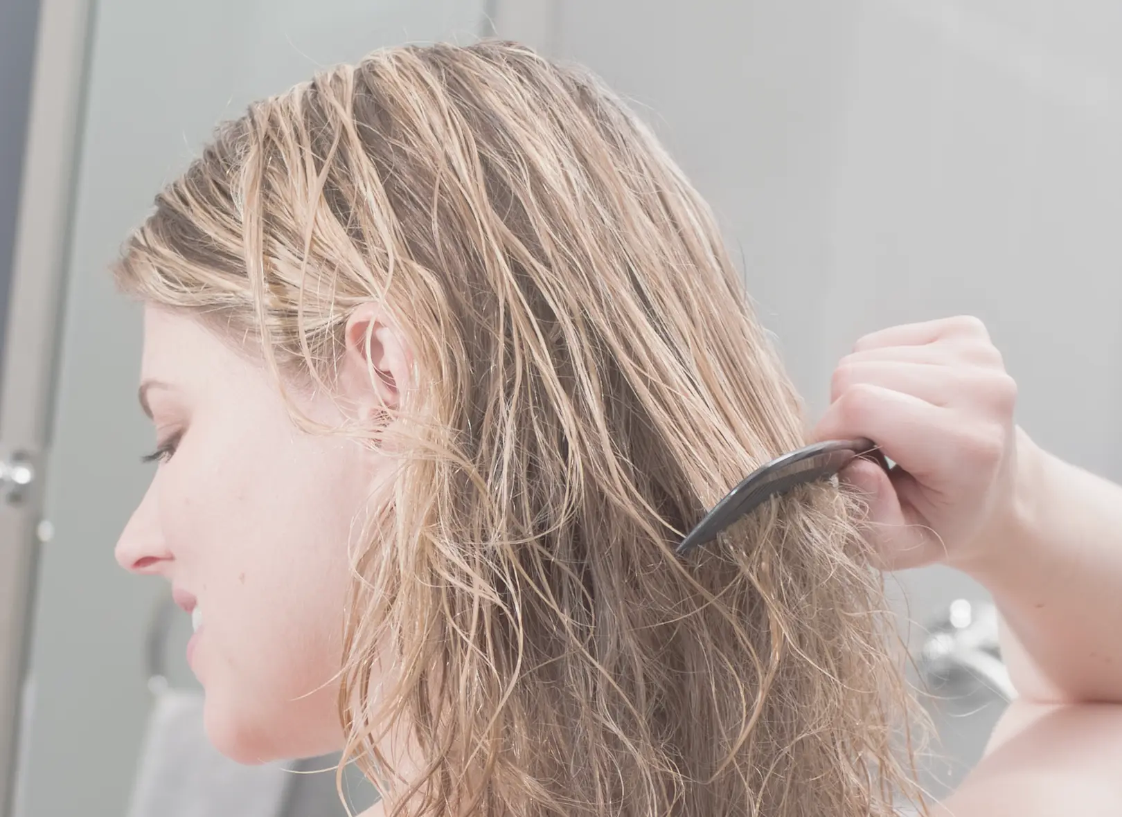 women coming hair impacted by hard water